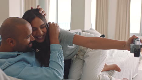 Couple-in-living-room-with-video-selfie