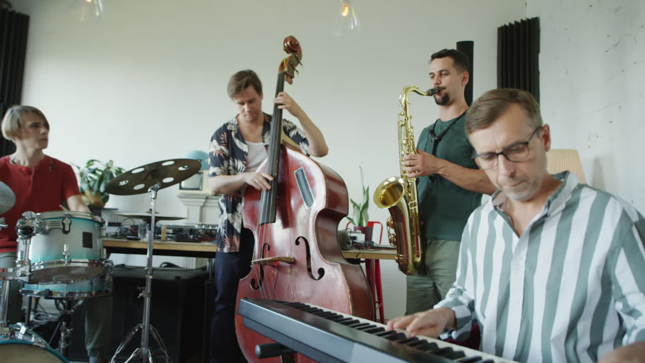 Jazz band performing with keyboard, saxophone, double bass, and drums