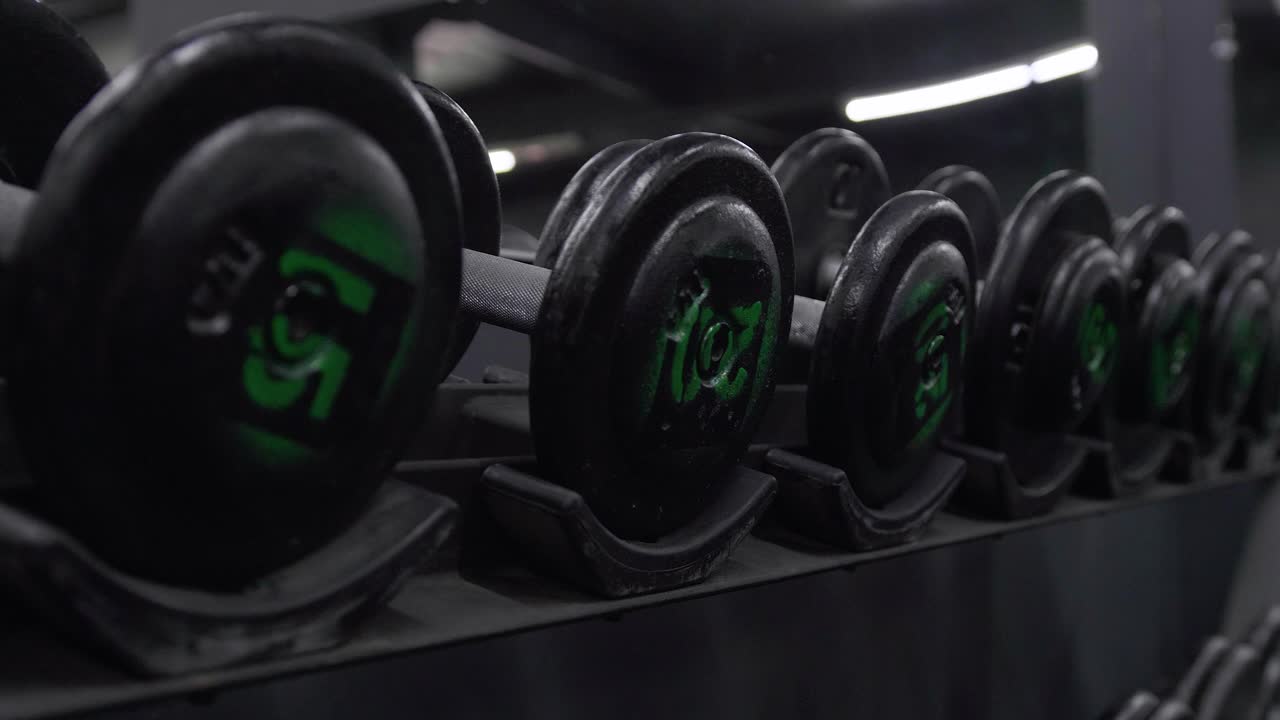 Dumbbells row low angle shot