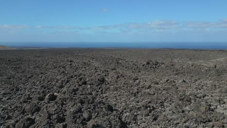 smooth aerial view flight volcano lava field lanzarote canary islands, sunny day spain 2023