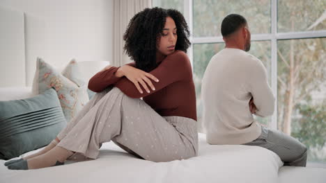 upset couple in bedroom after argument