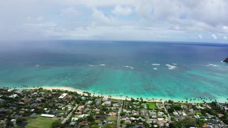 drone shot of the hawaiian seas off the coast of oahu, neighborhoods underneath