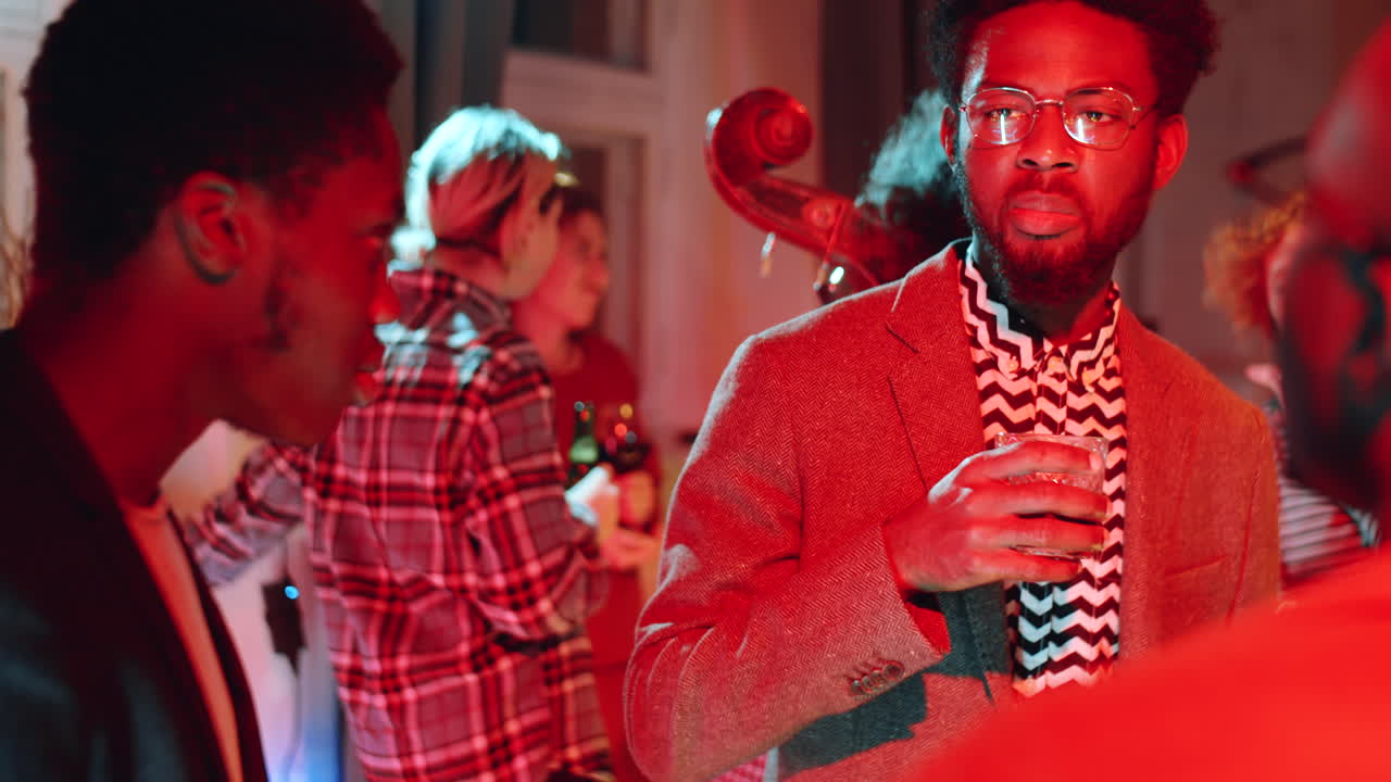 African American Man Discussing Concert with Friends on Afterparty