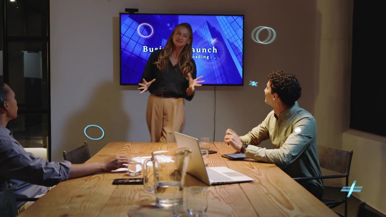 Host entering greeting man then prepping business launch while icons floating over laptop screen