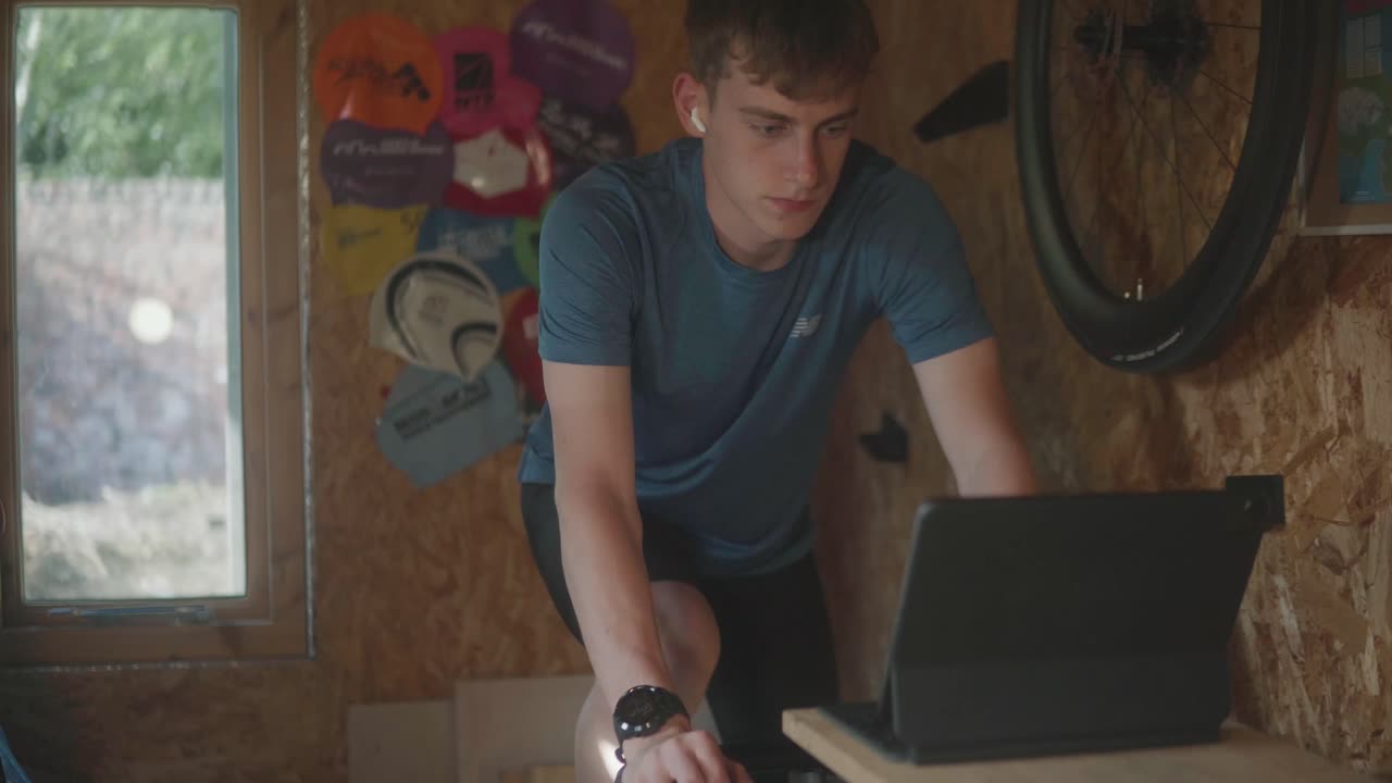Footage of a cyclist on an indoor turbo training
