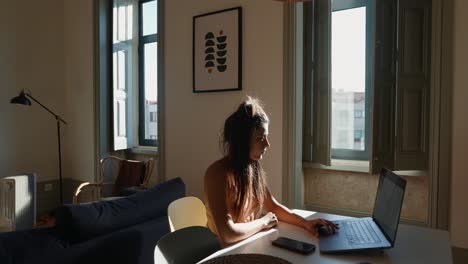 woman working from home in a cozy apartment