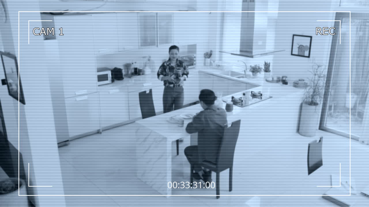 CCTV of Asian Wife and Husband Having Talk during Home Breakfast
