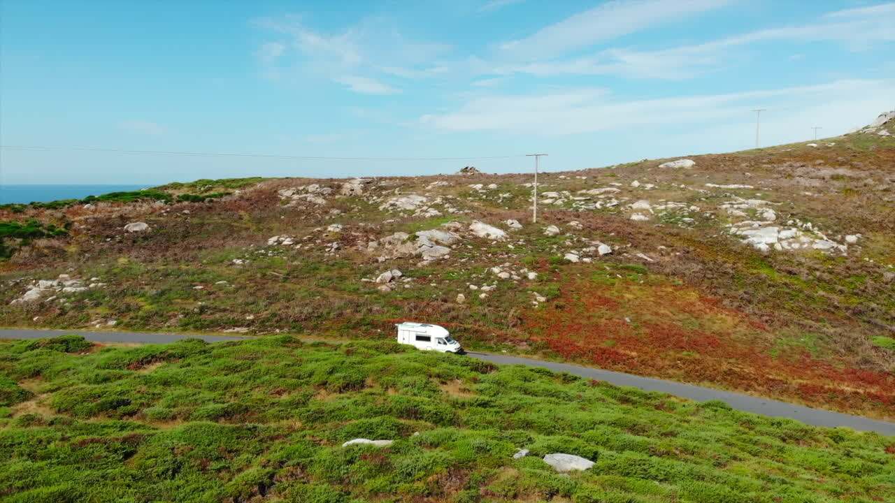 Campervan on a scenic road in the countryside