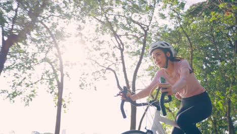 woman cycling in a park