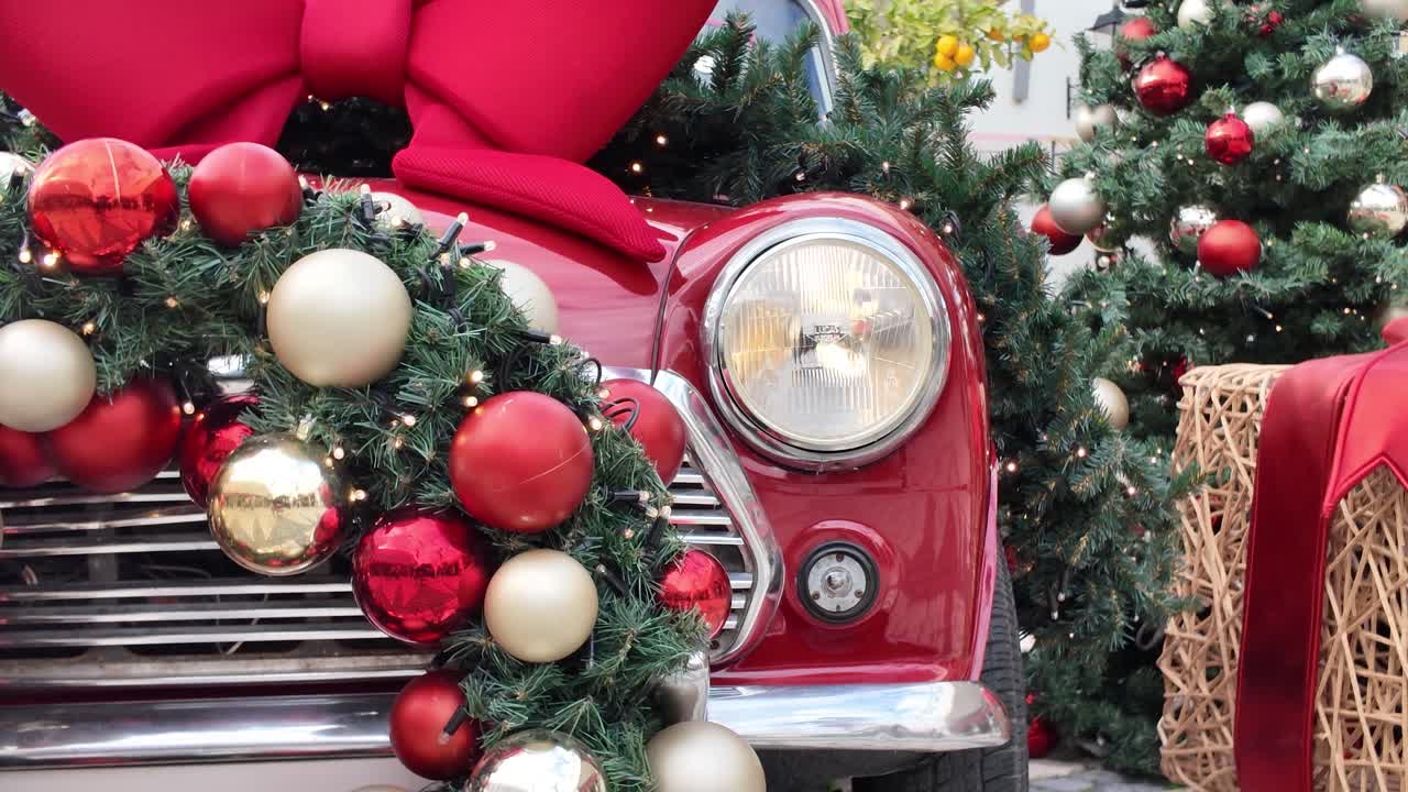 Charming holiday scene combining a Christmas tree with a decorative red car featuring a large bow