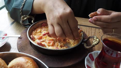 woman eating turkish menemen