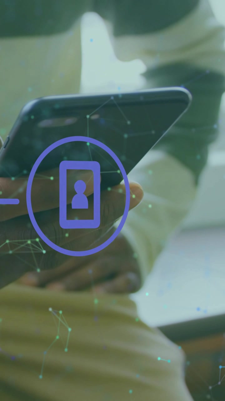 Vertical video: Man tilting phone near window showing purple icon on phone and green dots for tech