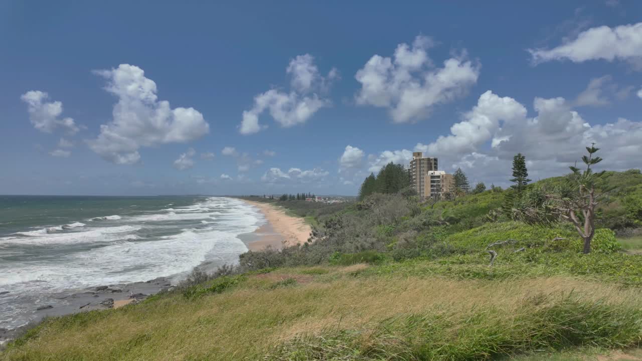 Sweeping view of a beautiful sandy beach from a view point in Australia