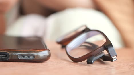 glasses and phone on a table