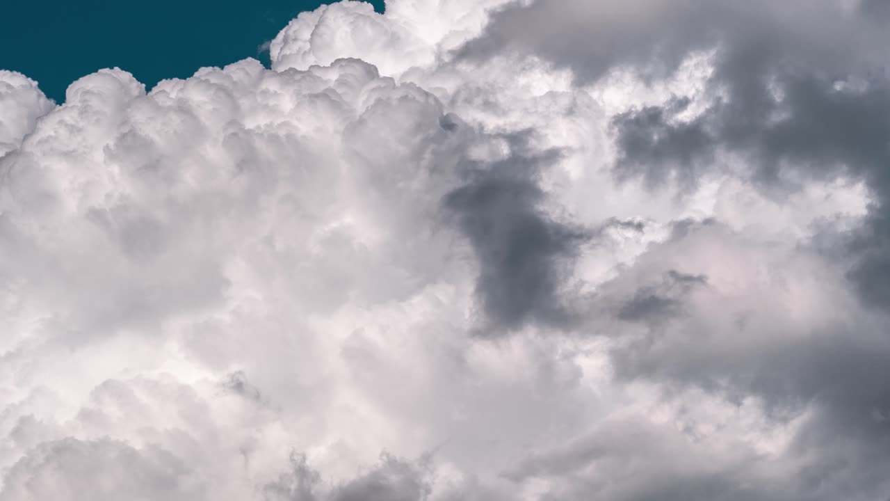 Majestic Cloud Formations Against a Teal Sky