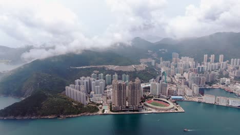 Hong-Kong-bay-and-waterfront-residential-skyscrapers,-Aerial-view