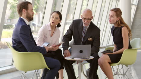 Business-Meeting-With-Laptop-In-Office-Foyer-Shot-On-R3D