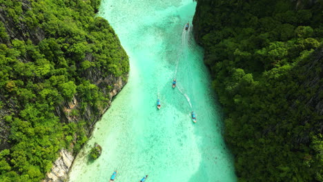 Aerial-over-tourist-diving-vessels-near-Pih-Leh-lagoon-off-Koh-Phi-Phi-Island,-Thailand