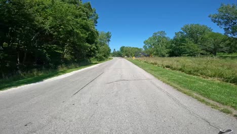 pov - driving past the dam outlet of saylorville lake and camping ground in central iowa