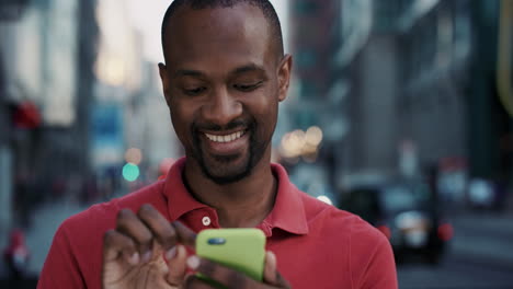 Slow-Motion-Portrait-of-happy-african-american-man-using-smart-phone