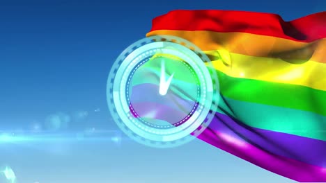 Animation-of-rainbow-flag-and-blue-clock-over-blue-background