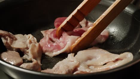 frying bacon in a pan