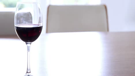 Close-up-of-glass-of-red-wine