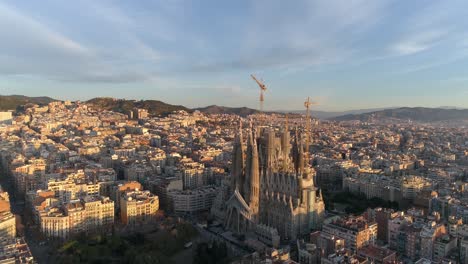 la sagrada familia cathedral and city of barcelona at sunrise