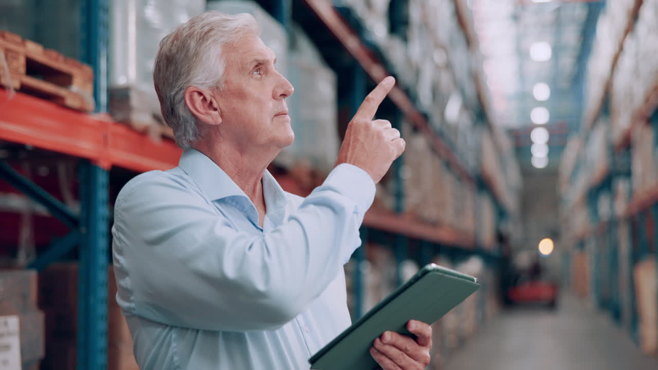Warehouse Supervisor Inspecting Inventory