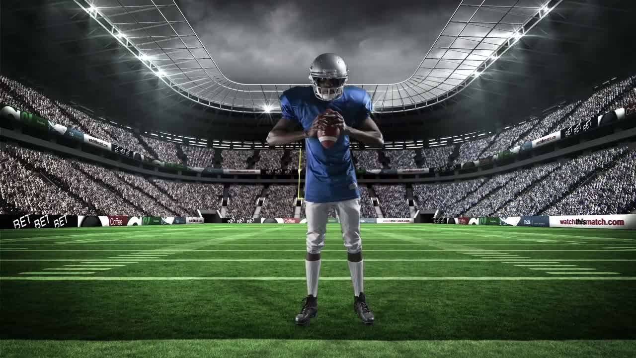 American football player holding ball