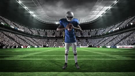 american football player holding ball