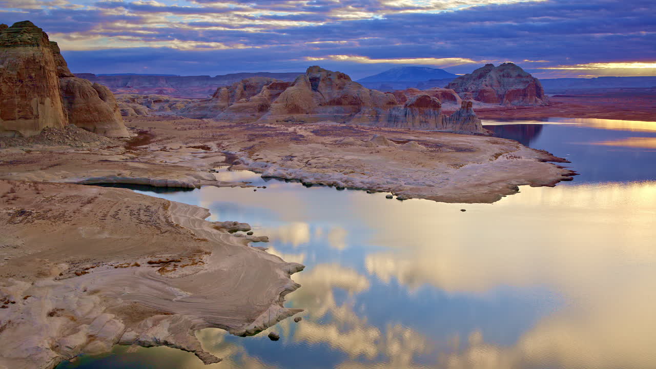 A cinematic high-angle shot capturing the timeless beauty of the desert and red rock landscape near Lake Powell.