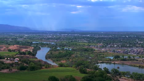 colorado river summer grand junction aerial drone grand mesa downtown main street circle left motion afternoon cloudy blue sky wine vineyards parachute fruitvale mt garfield western close delta usa