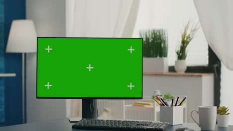 empty bright living room with isolated mock-up green screen chroma key monitor