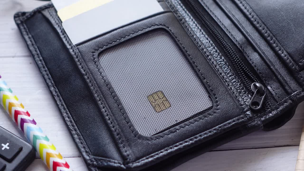Close up of credit cards in a wallet on wooden background ,