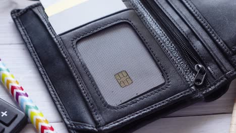 close up of credit cards in a wallet on wooden background ,