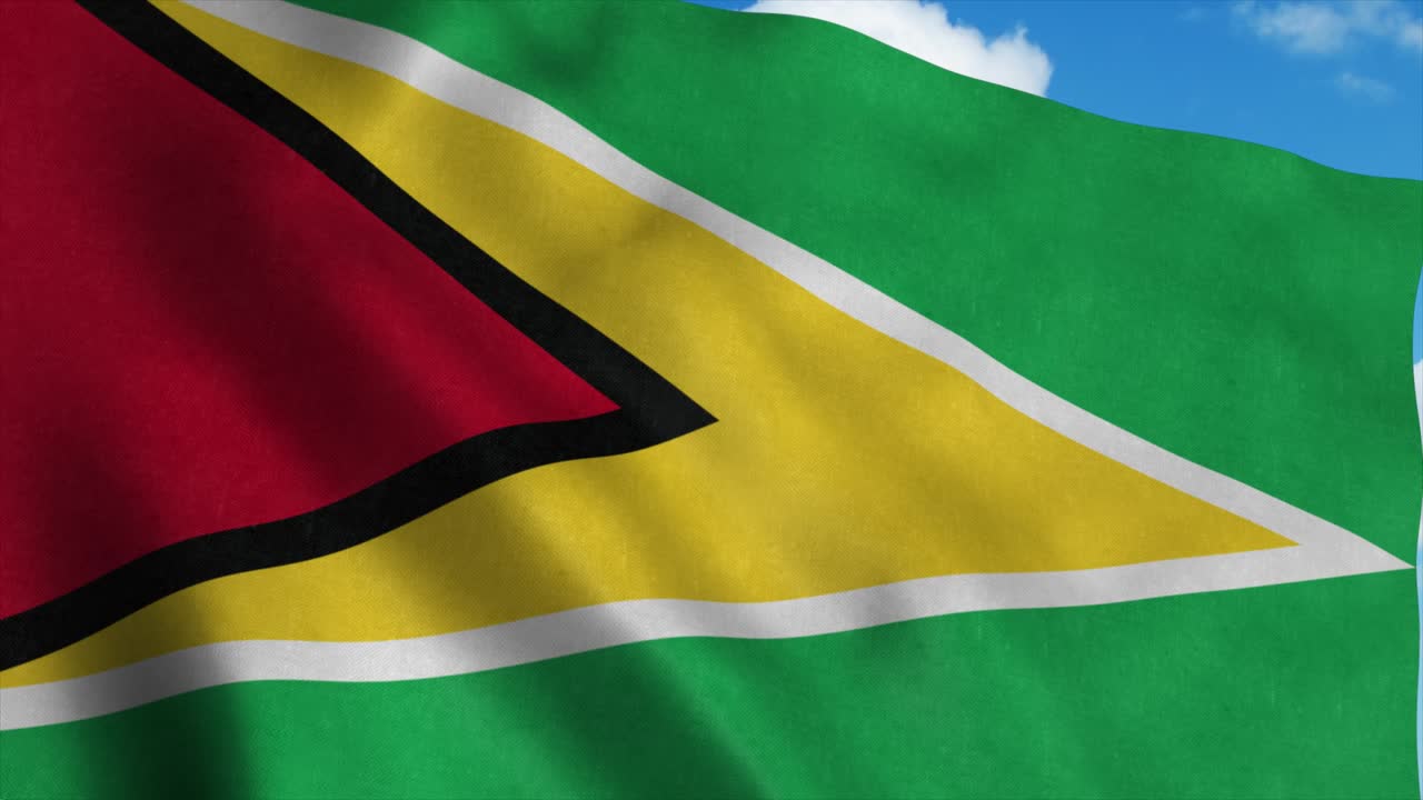 Bandiera della Guyana che sventola al vento, sfondo cielo blu. 4K