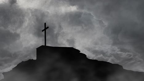 grave with cross on top of mountain silhouette