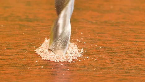 drill twists a screw in wooden board drill twists a screw in wooden board
