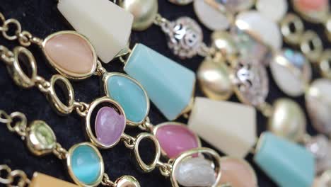 close-up of colorful beaded necklaces