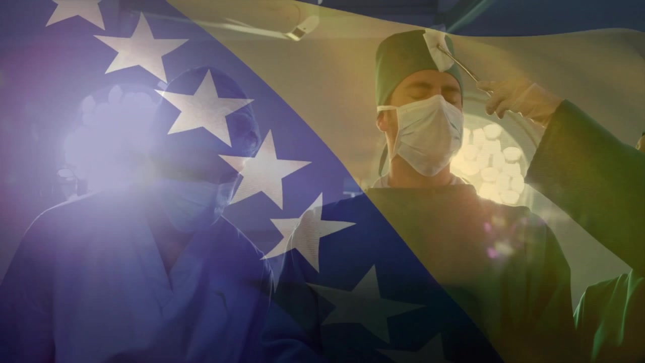 Assistant lifting surgeon headlamp after discussion in surgery, adjusting lighting for precision