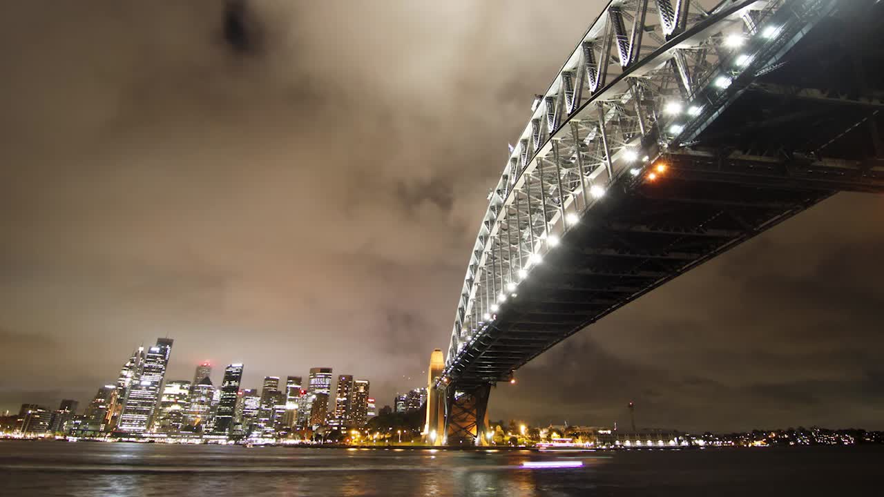 Close view time lapse of the Sydney Harbour Bridge at night.