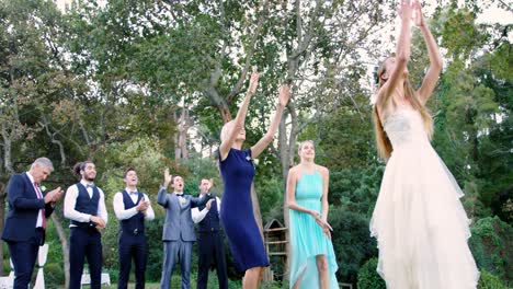 Bride-throwing-wedding-bouquet-to-wedding-guest-4K-4k