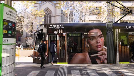 tram arriving at a city stop