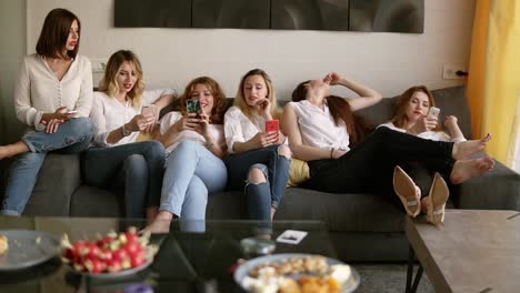 six beautiful girls relaxing on the couch