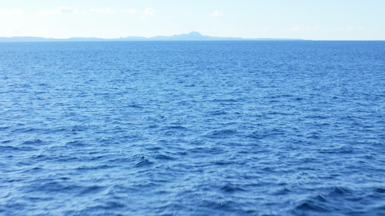 Vast Ocean View with Distant Island
