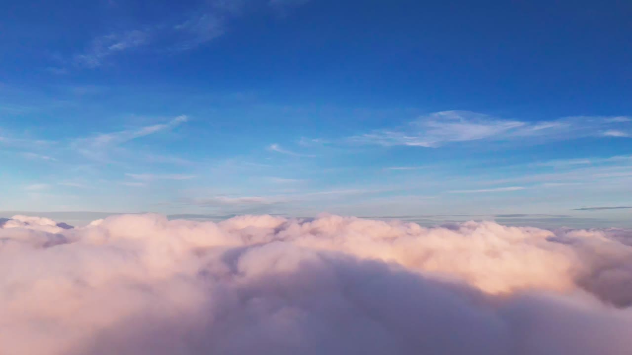 Surreal aerial view of soft marshmallow-pink clouds against a deep azure sky. A dreamy "cotton candy" aesthetic with minimal horizon, perfect for fantasy, lo-fi, and spiritual backgrounds