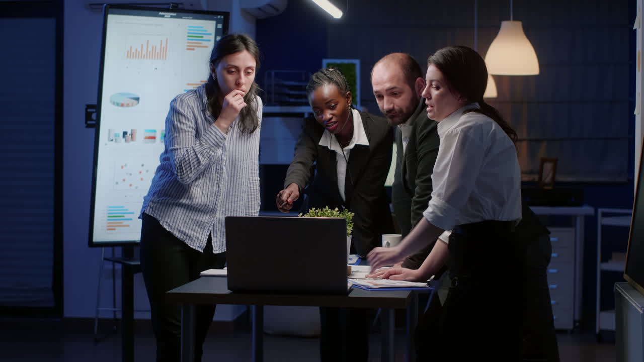 Multi ethnic business teamwork brainstorming corporate ideas analyzing management graphs