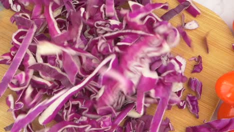 chopped red cabbage on a wooden cutting board
