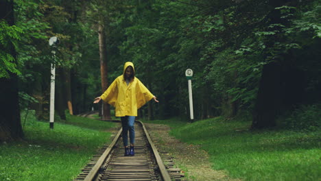 portrait shot of a good loking woman in a yellow raincoat